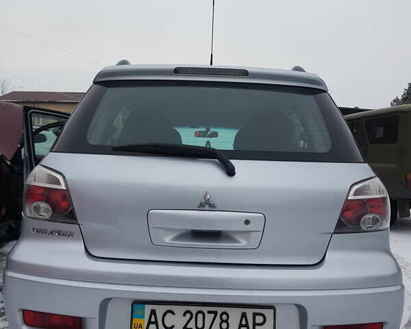 Серый Мицубиси Аутлендер, объемом двигателя 2.38 л и пробегом 700 тыс. км за 7058 $, фото 5 на Automoto.ua