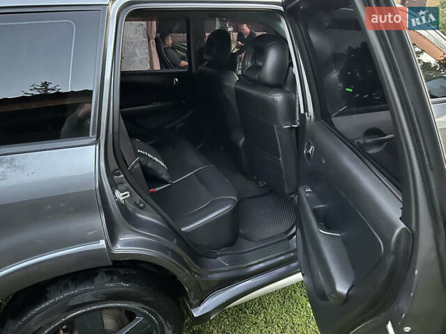 Сірий Міцубісі Аутлендер, об'ємом двигуна 2.38 л та пробігом 273 тис. км за 8000 $, фото 10 на Automoto.ua