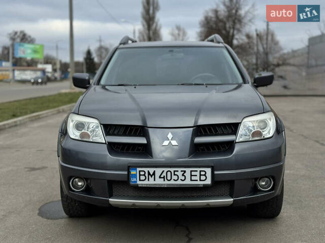 Серый Мицубиси Аутлендер, объемом двигателя 2.38 л и пробегом 254 тыс. км за 7300 $, фото 3 на Automoto.ua