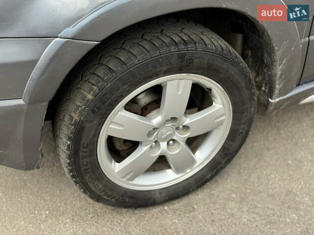 Серый Мицубиси Аутлендер, объемом двигателя 2.38 л и пробегом 254 тыс. км за 7300 $, фото 16 на Automoto.ua