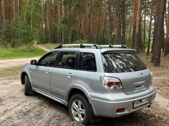 Серый Мицубиси Аутлендер, объемом двигателя 2.4 л и пробегом 225 тыс. км за 6500 $, фото 5 на Automoto.ua