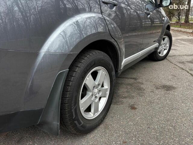 Серый Мицубиси Аутлендер, объемом двигателя 2.4 л и пробегом 237 тыс. км за 8490 $, фото 10 на Automoto.ua