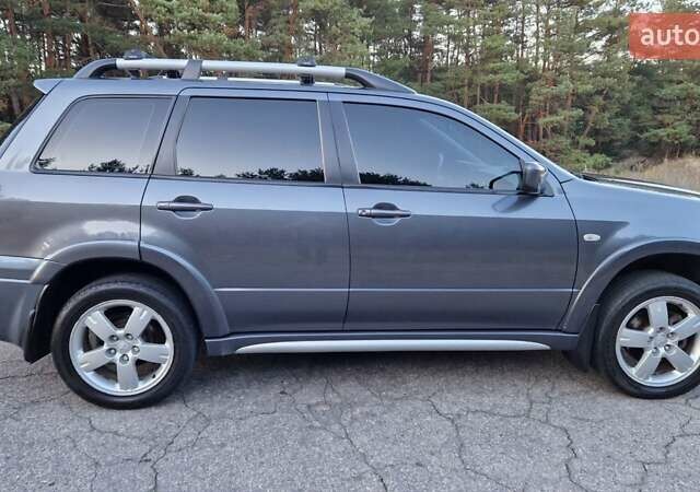 Серый Мицубиси Аутлендер, объемом двигателя 2 л и пробегом 157 тыс. км за 8300 $, фото 22 на Automoto.ua