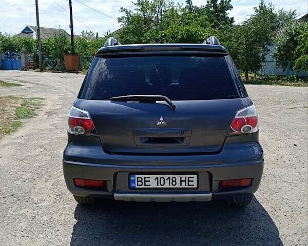 Серый Мицубиси Аутлендер, объемом двигателя 2.35 л и пробегом 342 тыс. км за 6900 $, фото 7 на Automoto.ua