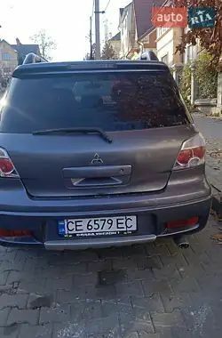 Серый Мицубиси Аутлендер, объемом двигателя 2 л и пробегом 176 тыс. км за 5400 $, фото 3 на Automoto.ua