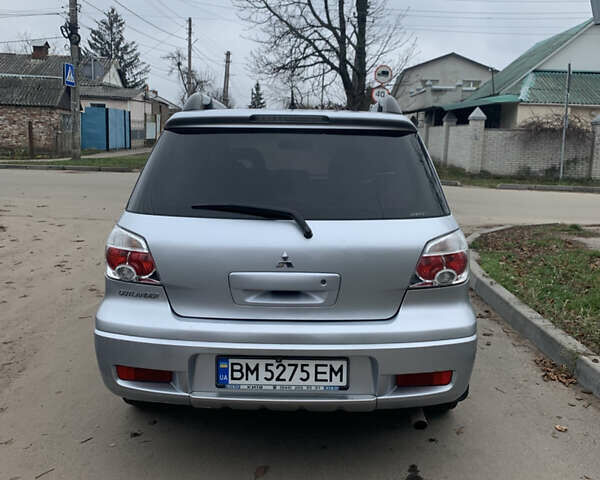 Серый Мицубиси Аутлендер, объемом двигателя 2 л и пробегом 247 тыс. км за 5999 $, фото 5 на Automoto.ua