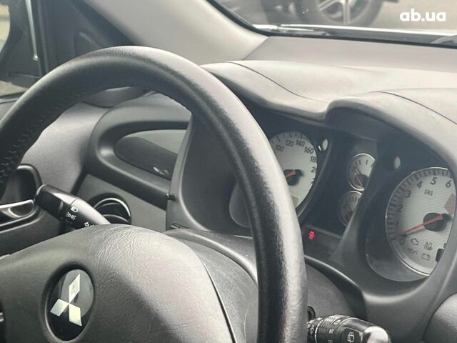 Серый Мицубиси Аутлендер, объемом двигателя 2.4 л и пробегом 324 тыс. км за 6890 $, фото 18 на Automoto.ua