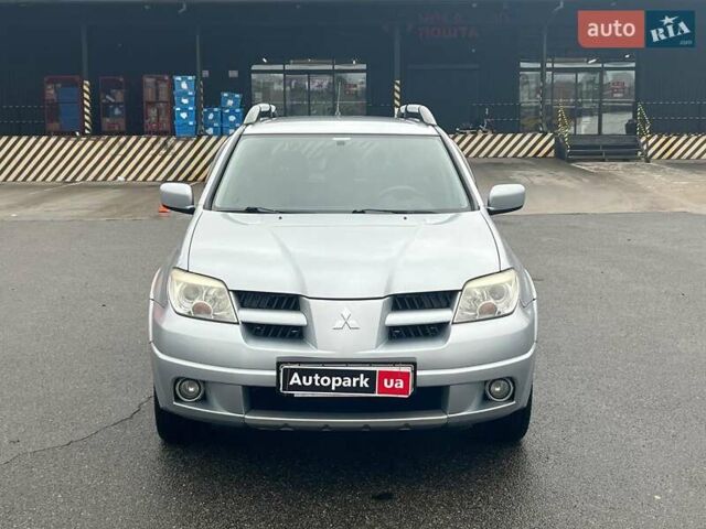 Серый Мицубиси Аутлендер, объемом двигателя 2.4 л и пробегом 324 тыс. км за 6890 $, фото 2 на Automoto.ua