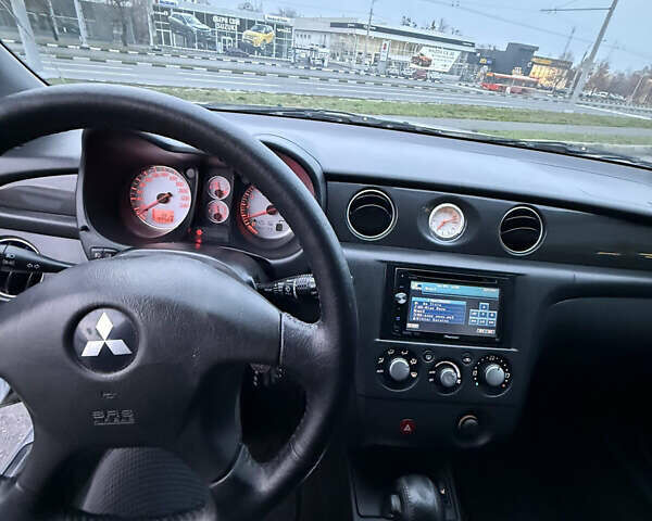 Сірий Міцубісі Аутлендер, об'ємом двигуна 2.4 л та пробігом 190 тис. км за 7500 $, фото 10 на Automoto.ua