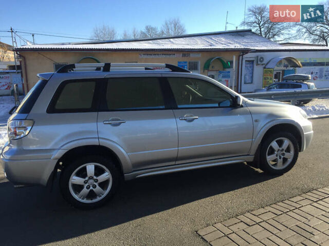 Серый Мицубиси Аутлендер, объемом двигателя 2.38 л и пробегом 191 тыс. км за 9950 $, фото 4 на Automoto.ua