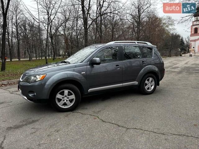 Серый Мицубиси Аутлендер, объемом двигателя 2.4 л и пробегом 237 тыс. км за 8490 $, фото 3 на Automoto.ua