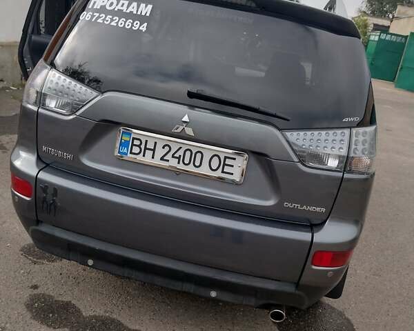 Серый Мицубиси Аутлендер, объемом двигателя 2.36 л и пробегом 313 тыс. км за 8800 $, фото 8 на Automoto.ua