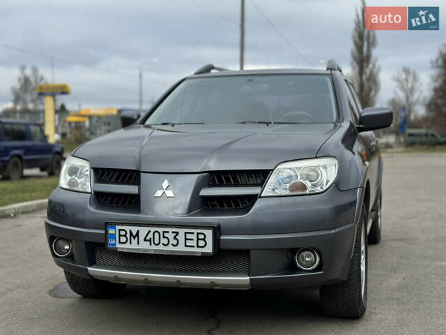 Серый Мицубиси Аутлендер, объемом двигателя 2.38 л и пробегом 254 тыс. км за 7300 $, фото 2 на Automoto.ua