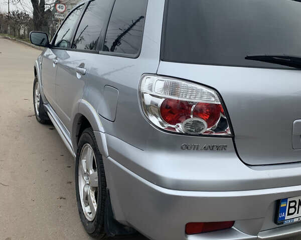 Серый Мицубиси Аутлендер, объемом двигателя 2 л и пробегом 247 тыс. км за 5999 $, фото 6 на Automoto.ua