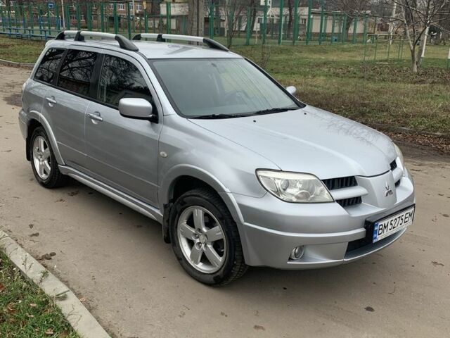 Серый Мицубиси Аутлендер, объемом двигателя 2 л и пробегом 247 тыс. км за 5999 $, фото 1 на Automoto.ua
