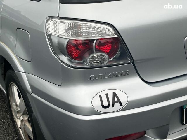 Серый Мицубиси Аутлендер, объемом двигателя 2.4 л и пробегом 324 тыс. км за 6890 $, фото 8 на Automoto.ua