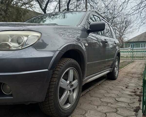 Серый Мицубиси Аутлендер, объемом двигателя 2.38 л и пробегом 143 тыс. км за 7300 $, фото 6 на Automoto.ua