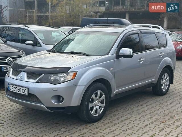 Серый Мицубиси Аутлендер, объемом двигателя 2.36 л и пробегом 237 тыс. км за 8900 $, фото 2 на Automoto.ua