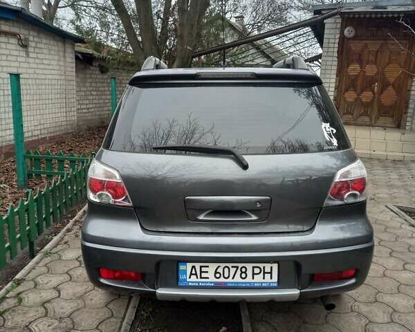 Серый Мицубиси Аутлендер, объемом двигателя 2.38 л и пробегом 143 тыс. км за 7300 $, фото 9 на Automoto.ua