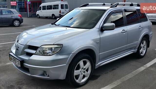 Серый Мицубиси Аутлендер, объемом двигателя 2.38 л и пробегом 323 тыс. км за 6800 $, фото 20 на Automoto.ua