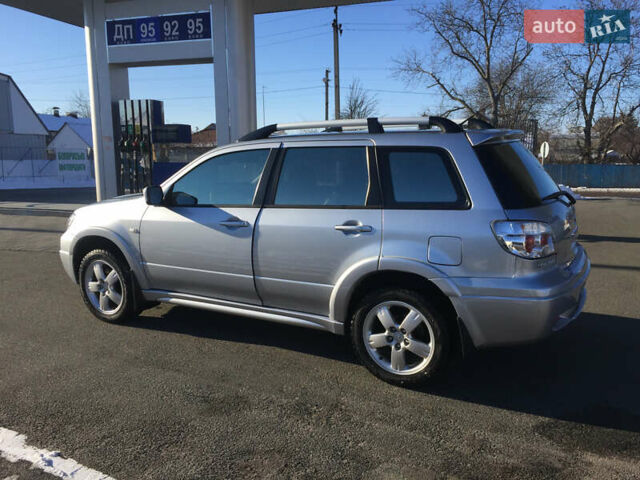 Серый Мицубиси Аутлендер, объемом двигателя 2.38 л и пробегом 191 тыс. км за 9950 $, фото 5 на Automoto.ua