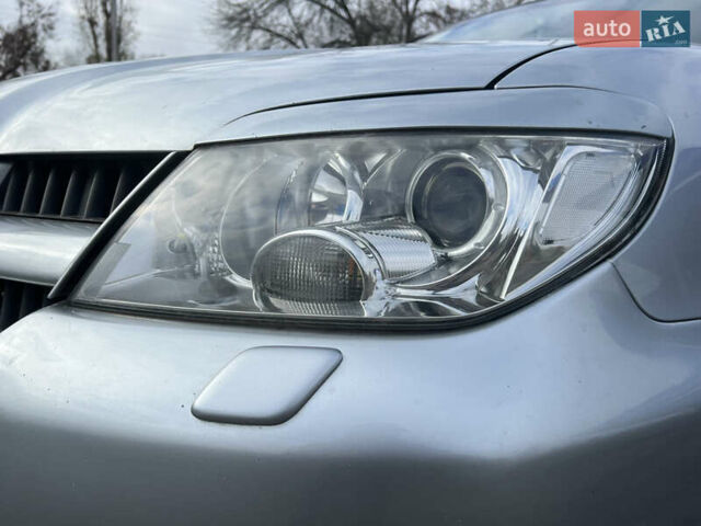 Серый Мицубиси Аутлендер, объемом двигателя 2.38 л и пробегом 197 тыс. км за 7699 $, фото 5 на Automoto.ua