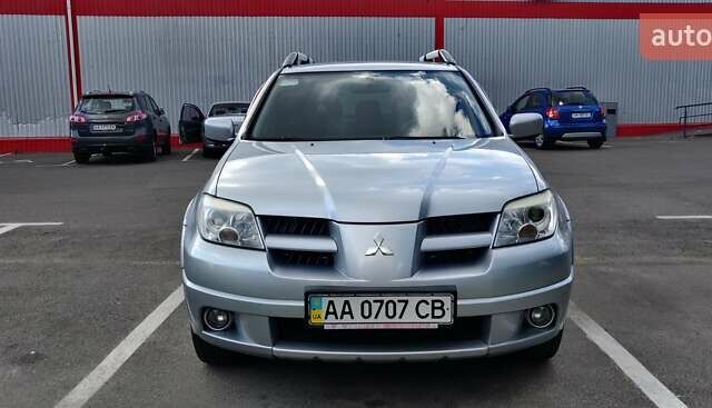 Серый Мицубиси Аутлендер, объемом двигателя 2.38 л и пробегом 323 тыс. км за 6800 $, фото 21 на Automoto.ua