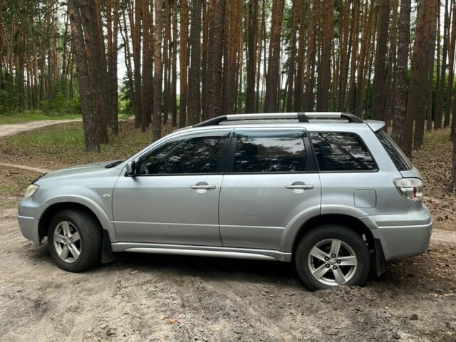 Серый Мицубиси Аутлендер, объемом двигателя 2.4 л и пробегом 225 тыс. км за 6500 $, фото 3 на Automoto.ua