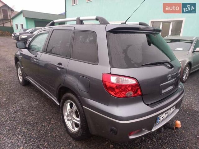 Серый Мицубиси Аутлендер, объемом двигателя 2 л и пробегом 232 тыс. км за 5950 $, фото 4 на Automoto.ua