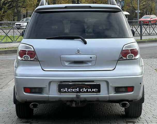 Серый Мицубиси Аутлендер, объемом двигателя 2.38 л и пробегом 197 тыс. км за 7699 $, фото 4 на Automoto.ua