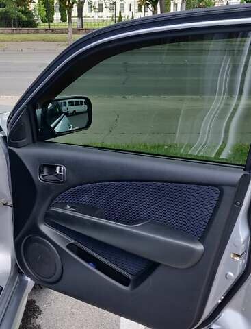 Серый Мицубиси Аутлендер, объемом двигателя 2.38 л и пробегом 323 тыс. км за 6800 $, фото 14 на Automoto.ua