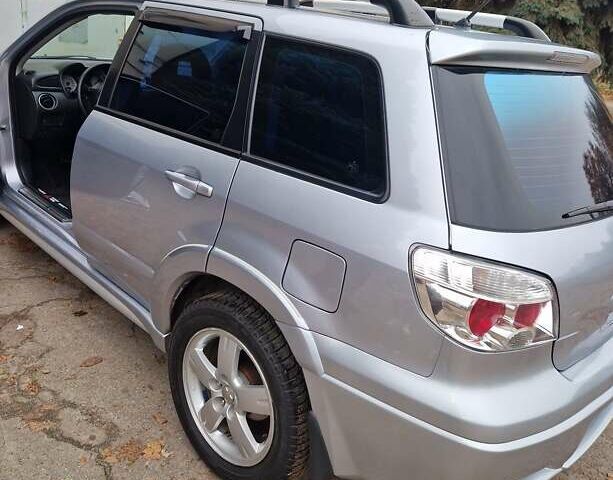 Серый Мицубиси Аутлендер, объемом двигателя 2.38 л и пробегом 113 тыс. км за 8900 $, фото 10 на Automoto.ua