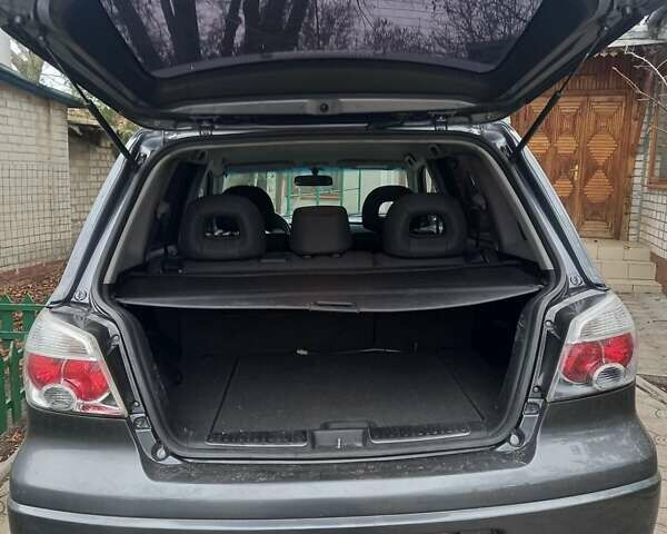 Серый Мицубиси Аутлендер, объемом двигателя 2.38 л и пробегом 143 тыс. км за 7300 $, фото 5 на Automoto.ua