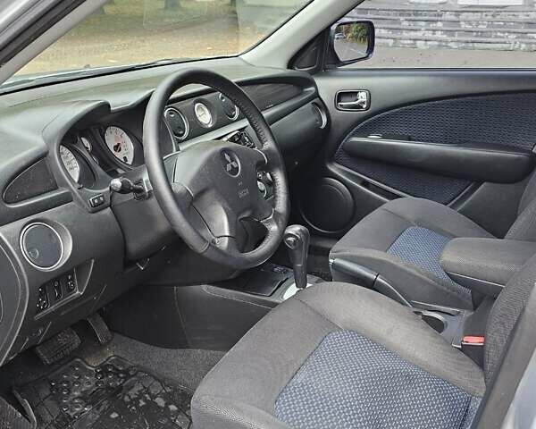 Сірий Міцубісі Аутлендер, об'ємом двигуна 2.38 л та пробігом 230 тис. км за 5500 $, фото 21 на Automoto.ua