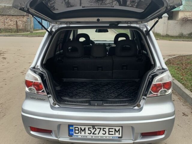 Серый Мицубиси Аутлендер, объемом двигателя 2 л и пробегом 247 тыс. км за 5999 $, фото 6 на Automoto.ua