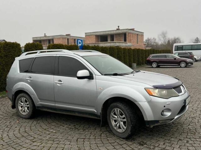 Серый Мицубиси Аутлендер, объемом двигателя 2.4 л и пробегом 285 тыс. км за 8500 $, фото 1 на Automoto.ua