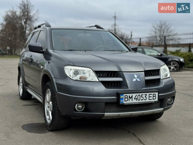 Серый Мицубиси Аутлендер, объемом двигателя 2.38 л и пробегом 254 тыс. км за 7300 $, фото 5 на Automoto.ua