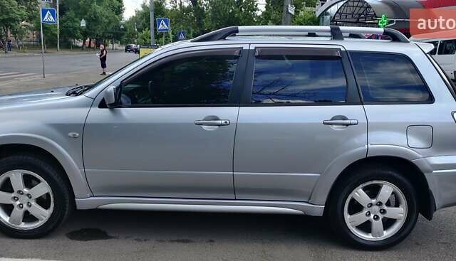 Серый Мицубиси Аутлендер, объемом двигателя 2.38 л и пробегом 323 тыс. км за 6800 $, фото 19 на Automoto.ua