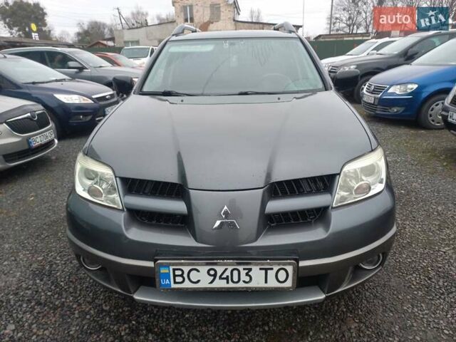 Серый Мицубиси Аутлендер, объемом двигателя 2 л и пробегом 232 тыс. км за 5950 $, фото 2 на Automoto.ua