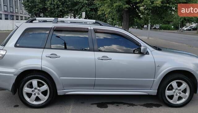 Серый Мицубиси Аутлендер, объемом двигателя 2.38 л и пробегом 323 тыс. км за 6800 $, фото 15 на Automoto.ua
