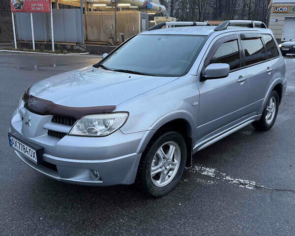 Сірий Міцубісі Аутлендер, об'ємом двигуна 2.4 л та пробігом 190 тис. км за 7500 $, фото 1 на Automoto.ua