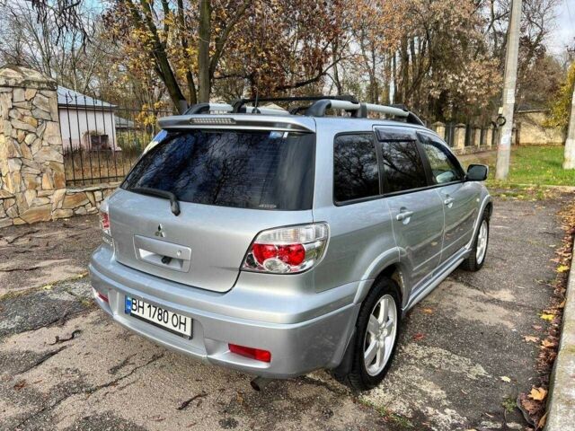 Серый Мицубиси Аутлендер, объемом двигателя 2.4 л и пробегом 170 тыс. км за 6900 $, фото 8 на Automoto.ua