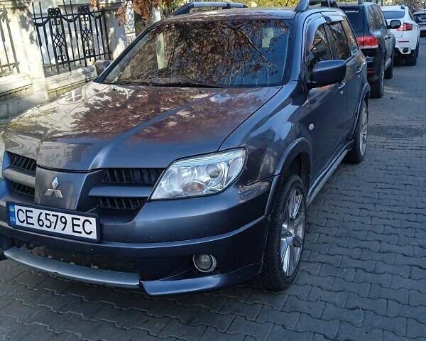 Серый Мицубиси Аутлендер, объемом двигателя 2 л и пробегом 172 тыс. км за 5900 $, фото 1 на Automoto.ua