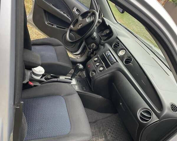 Сірий Міцубісі Аутлендер, об'ємом двигуна 2.38 л та пробігом 209 тис. км за 7460 $, фото 2 на Automoto.ua