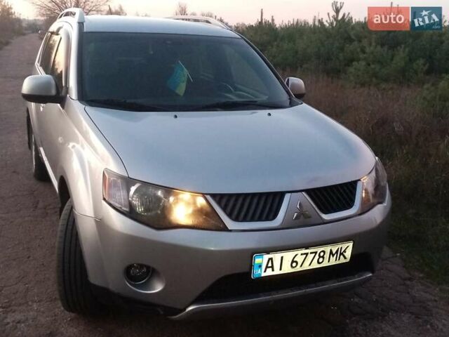 Серый Мицубиси Аутлендер, объемом двигателя 2.4 л и пробегом 200 тыс. км за 8700 $, фото 2 на Automoto.ua