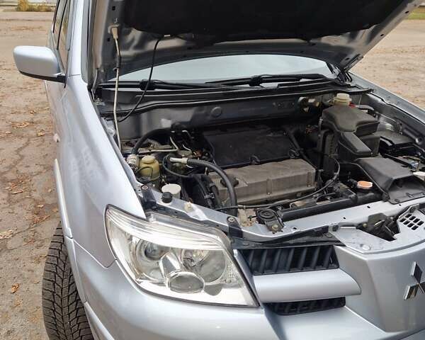 Серый Мицубиси Аутлендер, объемом двигателя 2.38 л и пробегом 113 тыс. км за 8900 $, фото 13 на Automoto.ua