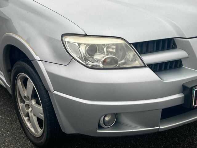 Сірий Міцубісі Аутлендер, об'ємом двигуна 2.4 л та пробігом 324 тис. км за 6890 $, фото 3 на Automoto.ua