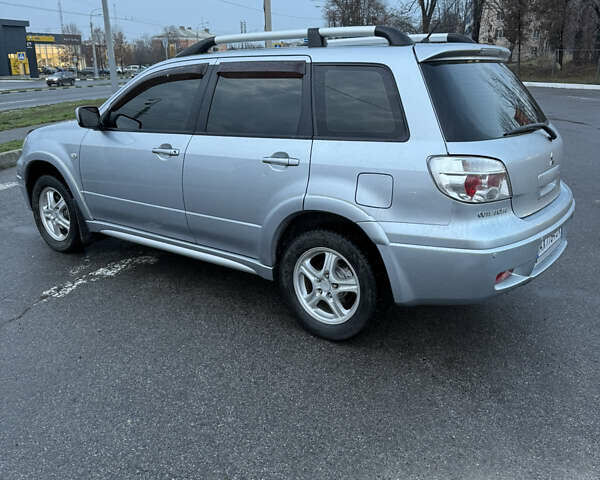 Сірий Міцубісі Аутлендер, об'ємом двигуна 2.4 л та пробігом 190 тис. км за 7500 $, фото 3 на Automoto.ua