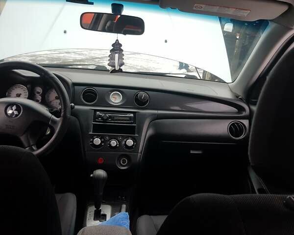 Серый Мицубиси Аутлендер, объемом двигателя 2.38 л и пробегом 700 тыс. км за 7058 $, фото 11 на Automoto.ua