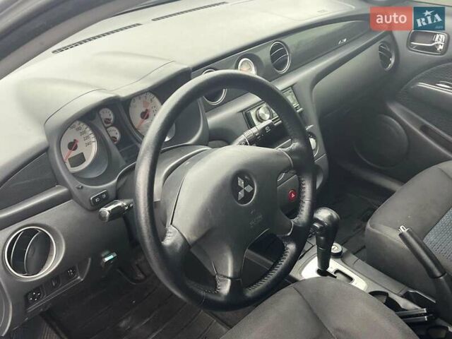 Серый Мицубиси Аутлендер, объемом двигателя 2.4 л и пробегом 324 тыс. км за 6890 $, фото 29 на Automoto.ua